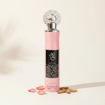 Pink air freshener with silver top on a white background