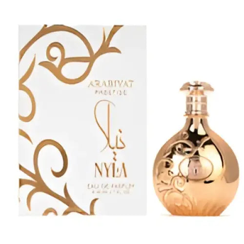 Golden ornate arabiyat prestige nyla edp perfume bottle with reflective surface and intricate embossed design fresh citrus notes