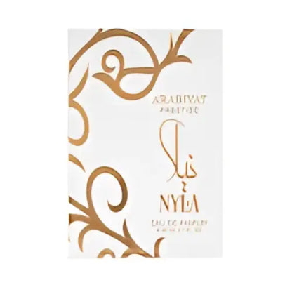 A white and gold ornate perfume bottle labeled sis and nyla for arabiyat prestige nyla fresh citrus nyla edp 80ml