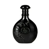 Black glossy nyla suede edp 80ml bottle with embossed floral design and circular neck label for suede woody fragrance