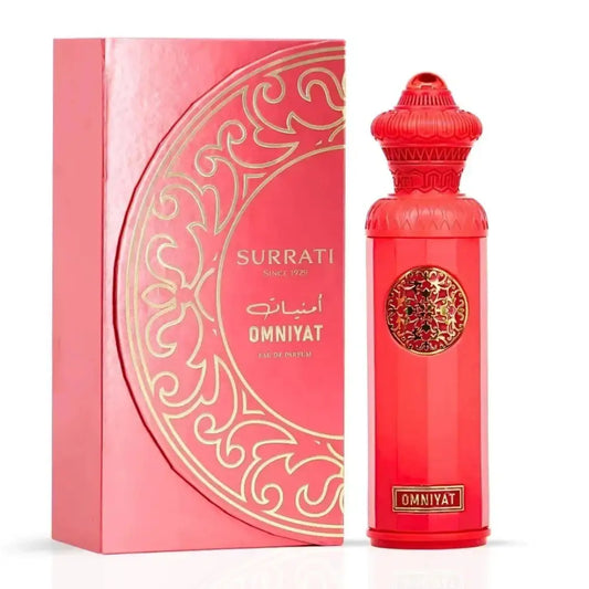 Vibrant red glass perfume bottle with intricate gold detailing and ornate cap next to pink luxury box omniyat eau de parfum