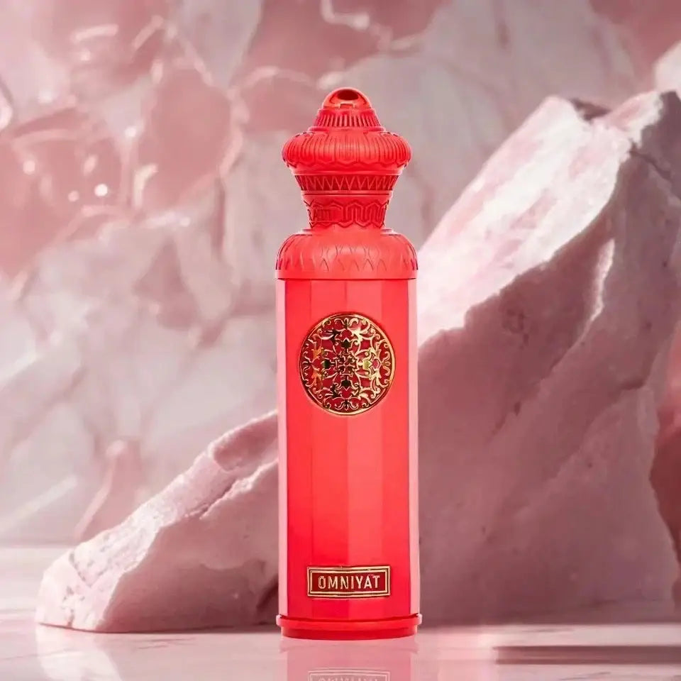 A vibrant red omniyat eau de parfum 140ml surrati heritage bottle with gold ornamental medallion and embossed brand name
