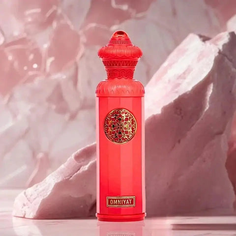 A vibrant red omniyat eau de parfum 140ml surrati heritage bottle with gold ornamental medallion and embossed brand name