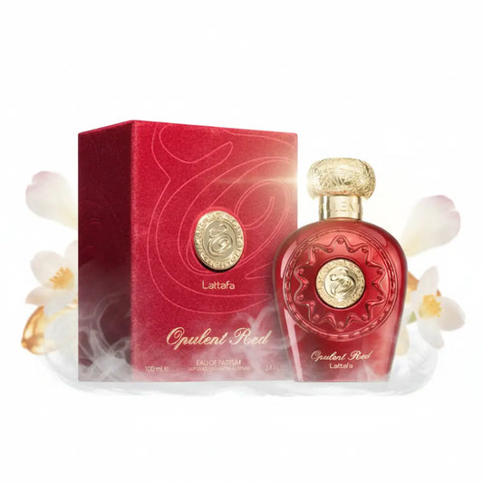 Red glass perfume bottle with gold accents and embossed design opulent red eau luxurious oriental fragrance by lattafa
