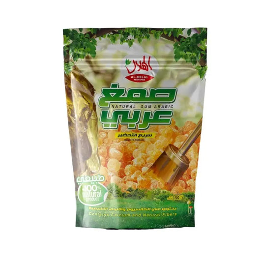 Organic arabic gum powder al-helal in glossy green and white resealable pouch showing golden-brown acacia senegal resin pieces