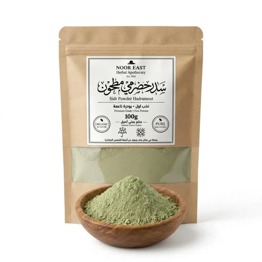 A 100g package of noor east herbal apothecary hadrami sidr green powder in a brown pouch for natural hair cleanser and stronger-looking hair
