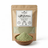 Herbal powder in a wooden bowl with a Noor East packaging on a white background