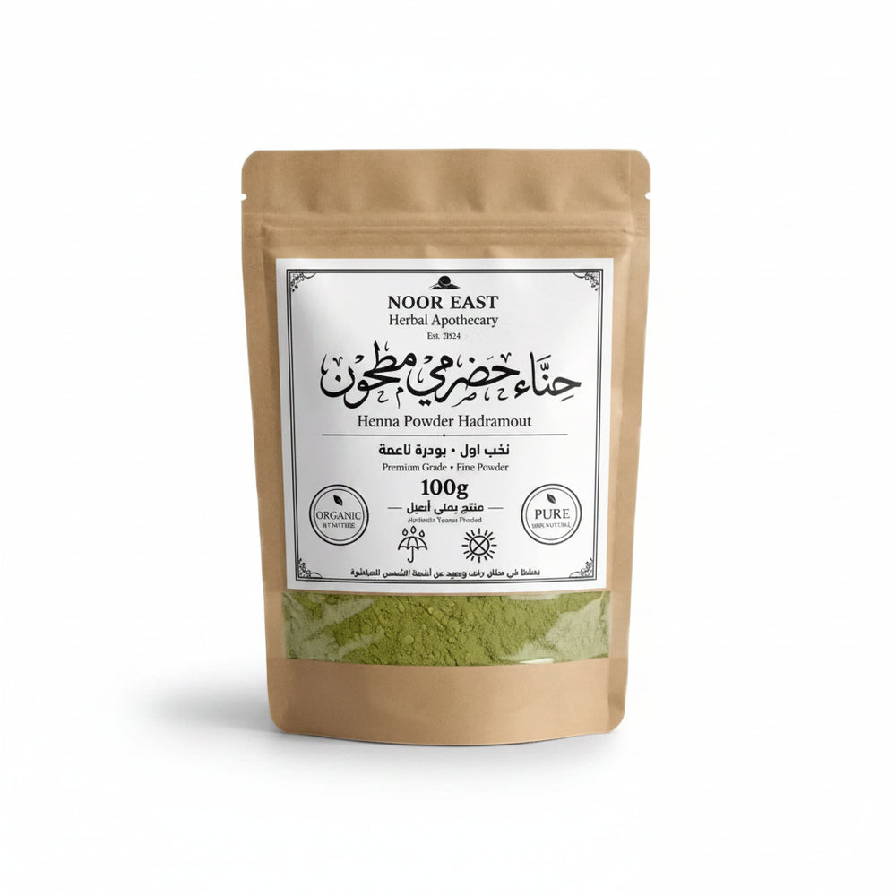 A brown resealable pouch of organic yemeni green henna powder labeled noor east herbal apothecary hadramout henna
