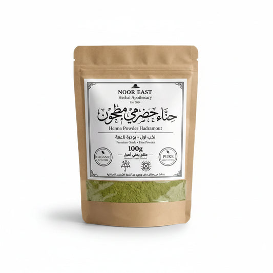 A brown resealable pouch of organic yemeni green henna powder labeled noor east herbal apothecary hadramout henna