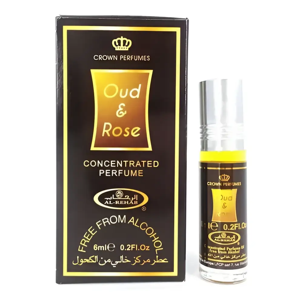 A sleek 6ml roll-on concentrated perfume oil bottle with silver cap and gold embossed oud and rose label from crown perfumes