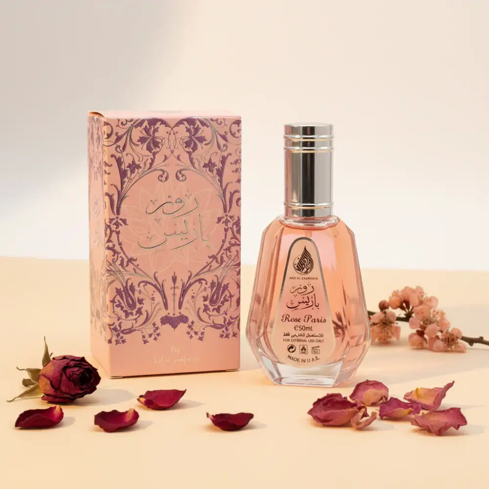 Perfume bottle and packaging with decorative design on a white background