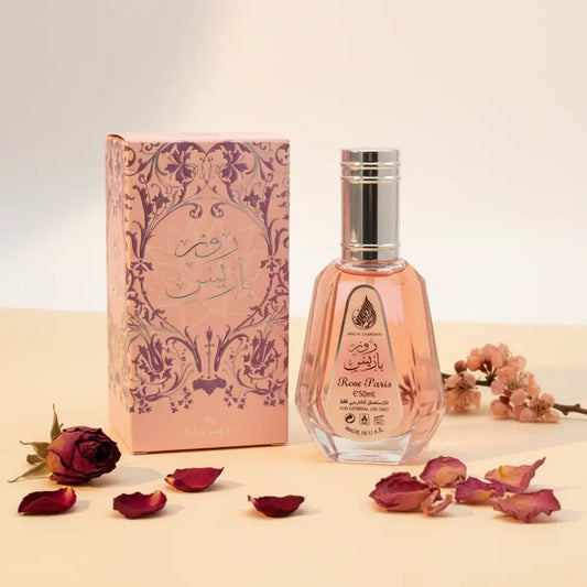 Perfume bottle and packaging with decorative design on a white background