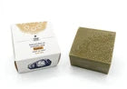 Olive oil aromatic soap with decorative packaging on a white background