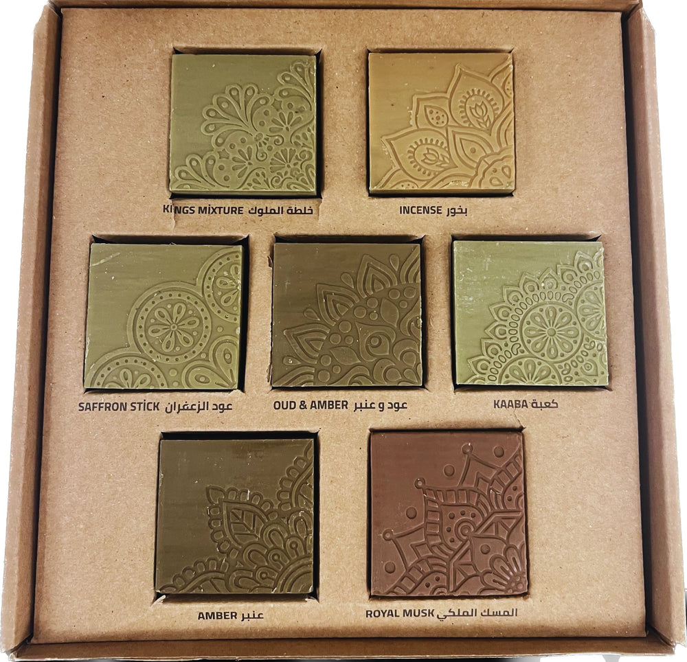 Set of incense bricks in a cardboard box with embossed designs and labels.