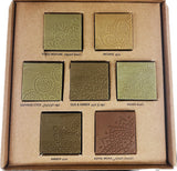 Set of incense bricks in a cardboard box with embossed designs and labels.