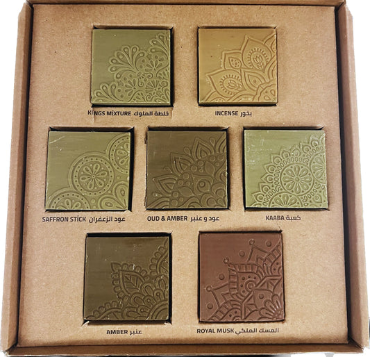 Set of incense bricks in a cardboard box with embossed designs and labels.