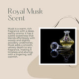Advertisement for Royal Musk Scent with an oil bottle and dropper on a dark background.
