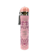 A pink cylindrical perfume bottle with Arabic calligraphy on the front, a pink cap, a gold collar, and a gray tassel, shown on a plain white background.