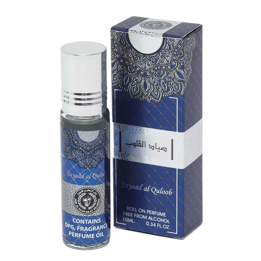 Perfume oil bottle and packaging with intricate design on a white background