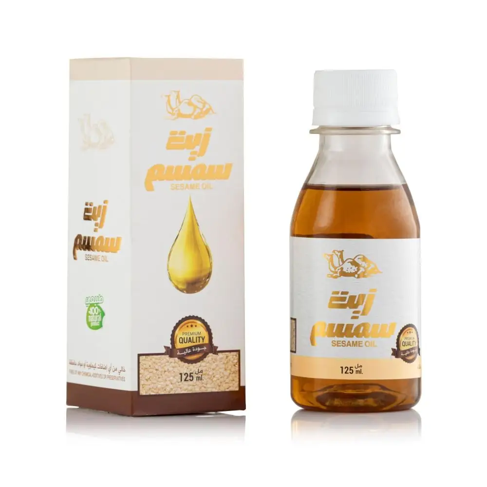 A 125 ml bottle of pure cold-pressed sesame oil in clear glass with white cap and gold arabic script free uk delivery