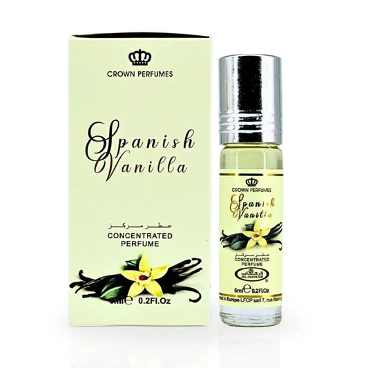 A slender transparent glass bottle with silver cap contains crown perfumes spanish vanilla concentrated perfume oil