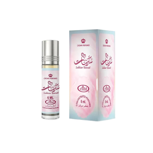 A sleek silver-topped glass rollerball bottle of sukkar banat concentrated perfume oil with a pink and white arabic label