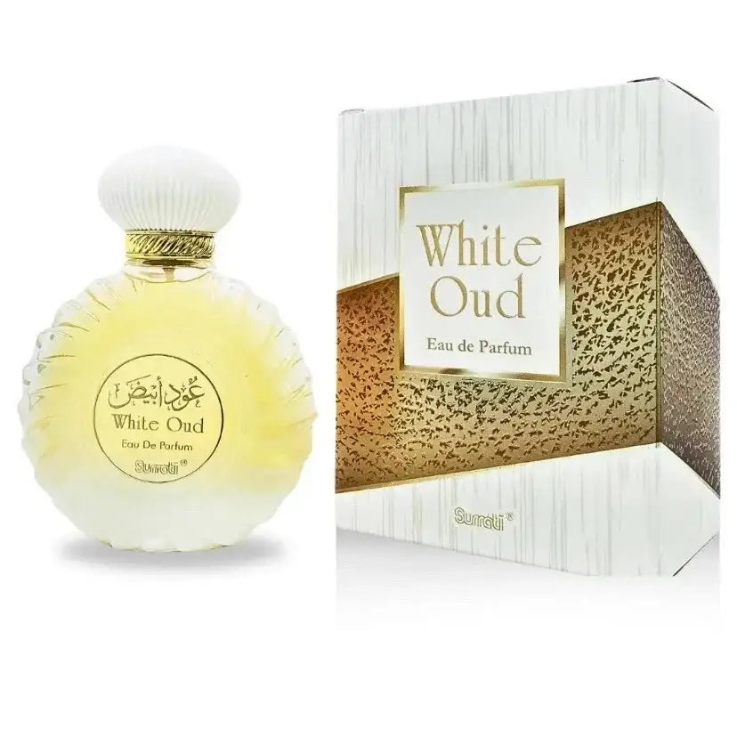 Elegant white and gold ribbed perfume bottle with pale yellow liquid from surrati oud collection black oud and white oud