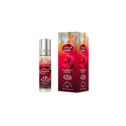 A sleek transparent glass rollerball bottle with silver cap and red label featuring tooty musk concentrated perfume oil