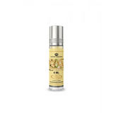 A sleek transparent glass roll-on concentrated perfume oil bottle with silver cap and floral label by crown perfumes