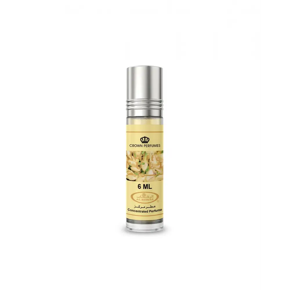A sleek transparent glass roll-on concentrated perfume oil bottle with silver cap and floral label by crown perfumes