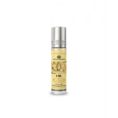 A sleek transparent glass roll-on concentrated perfume oil bottle with silver cap and floral label by crown perfumes