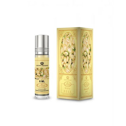 A sleek silver-topped glass rollerball bottle of al rehab white full concentrated perfume oil 6 ml beside ornate gold packaging