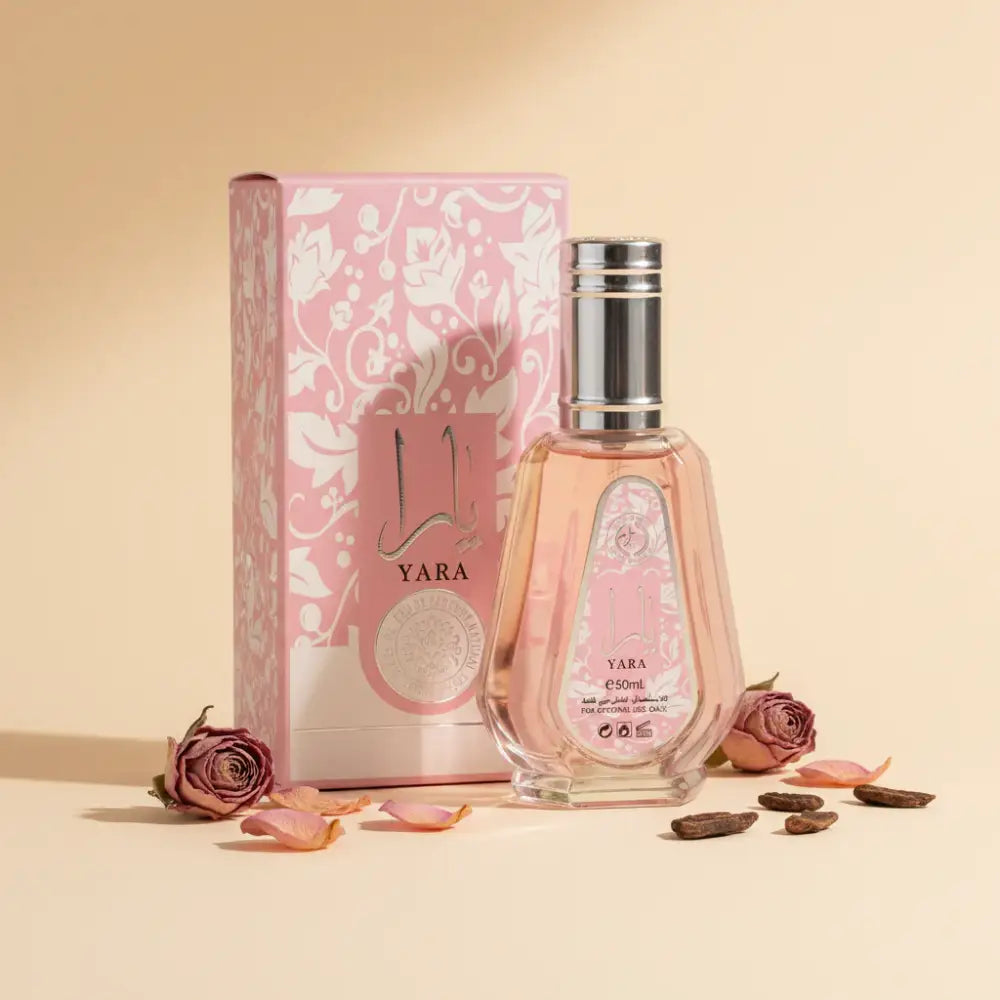 A pink yara edp 50ml perfume bottle by ard al zaafaran with silver cap clear glass and ornate label showcasing gourmand accord
